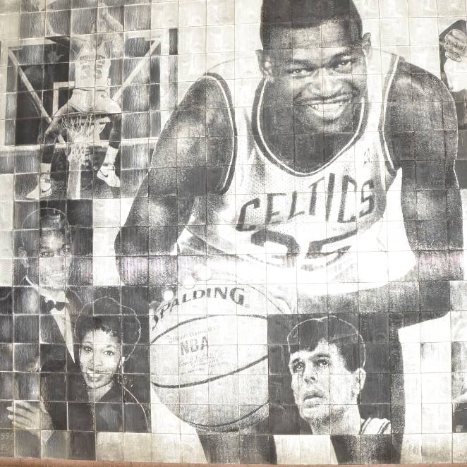 Reggie Lewis mural at Reggie Lewis Center - illustrating Reggie smiling with basketball